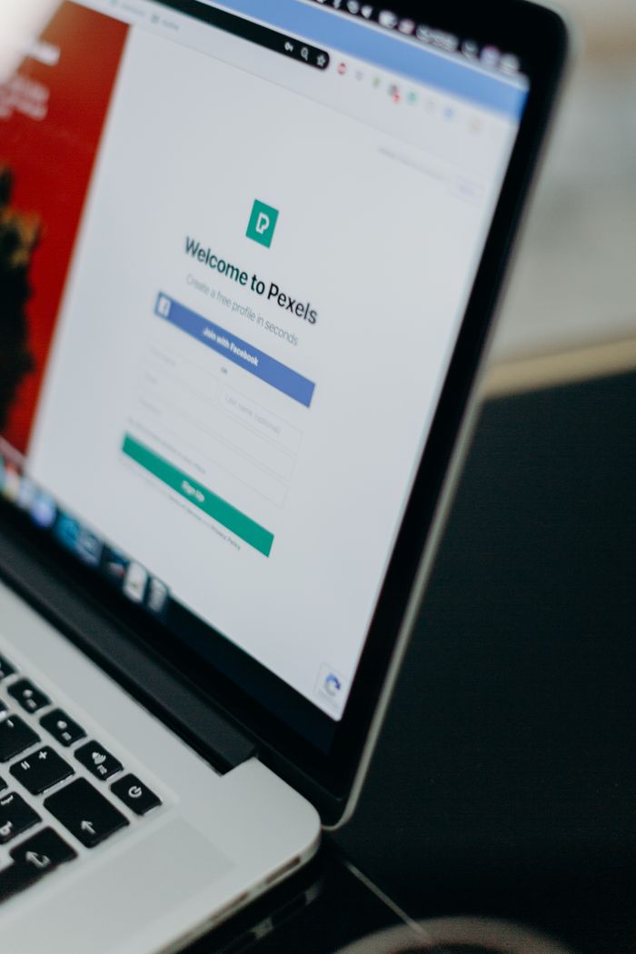 Focused shot of a laptop displaying the Pexels login page, highlighting modern digital interface.